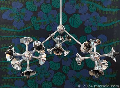 MaxSold Auction: This online auction features Post Modern furniture such as barrel chairs, dining table, and chandeliers, lucite table lamp, teak table lamp, abstract painting, saucer ceiling light, and much more.