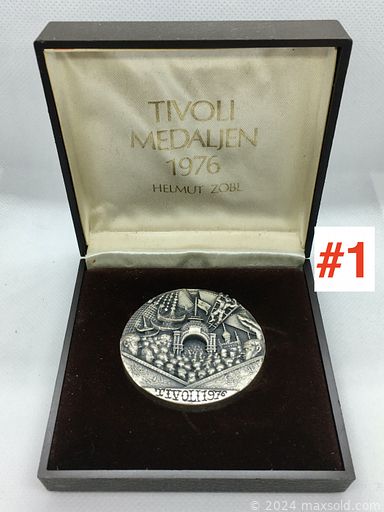 MaxSold Auction: This online auction includes Tivoli medallions, coins, vintage jewelry, watches, Russian silver beaker, vintage military cap badges, Royalty souvenirs and much more!