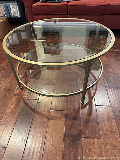 MaxSold Auction: This online auction features glass top tables, oak barrel table, sideboard, treadmill, shelving units, armoire, sports trading cards, storage bench, guitar, decanters, and more!