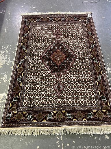 MaxSold Auction: This online auction includes handmade wool rugs from Iran and more!