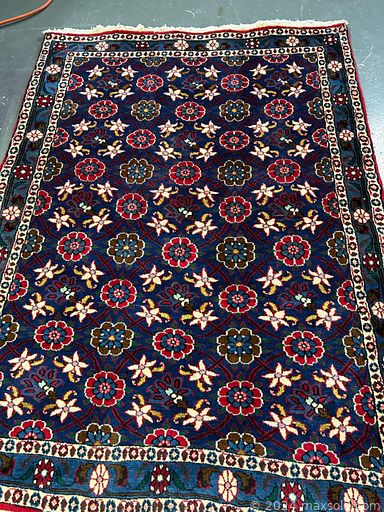 MaxSold Auction: This online auction includes handmade wool rugs from Iran and more!