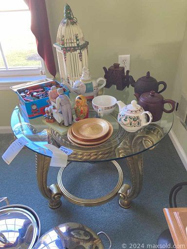 MaxSold Auction: This online auction features umbrella Stand, grandfather clock, wall art, photo frames, table, mirror, cutting mat, office supplies, Wingback Chair, weights, dining table, cabinet, wine rock, glassware and much more!