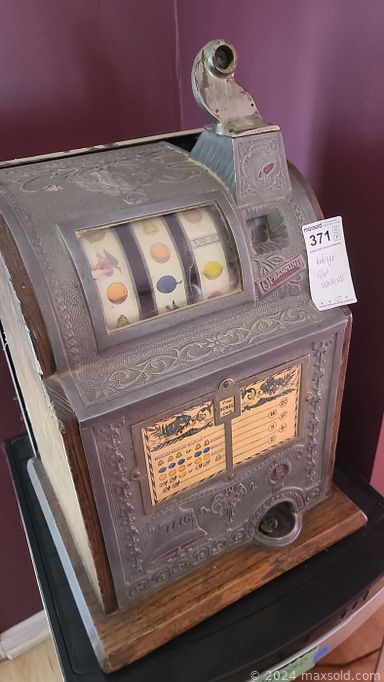 MaxSold Auction: This online auction includes furniture such as patio chairs, table, wood shelving units, swivel chair, oak dresser, dining table set, marble top coffee table, cubbyhole storage cabinet, wicker chairs, White Clad Simmons ice chest and others, kitchenware, small kitchen appliances, arc welder and other tools, hardware, bridle, saddles and other cowboy items, camping supplies, ski equipment, ceiling lights, fireproof safe, brassware, decor, gumball machine, electronics, Cub Cadet riding mower, Whitney Chicago baby grand piano, antique slot machine and much more!