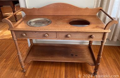 MaxSold Auction: This online auction includes furniture such as an antique secretary, side tables, rocker, vanity chairs, drafting table, antique washstand, couch and others, power tools, hand tools, hardware, kitchenware, small kitchen appliances, books, vinyl records, seasonal decor, lamps, wooden clock, vintage stuffed animals, bells, organ, miniature wood stove, photography items, GE washing machine, yard tools, wall art, massage cushion, cleaning tools, Royal Worcester, Goebel and other figures, pottery, wicker items, clothing, accessories and many more! n