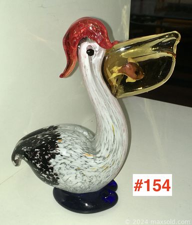 MaxSold Auction: This online auction includes Ikora glass bowls, MCM barometer, vases, Murano glass, lamps, pewter teapots, coffee cups, lighter set, art glass, torchiere floor lamp, atomizer bottles, vintage perfume bottles, furniture such as a teak bookcase, teak chair, rattan loveseat, side table, chrome bar cart and much more!