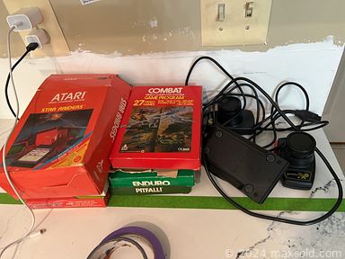 MaxSold Auction: This online auction includes furniture such as a china cabinet, coffee table, shelving units, storage cabinets, chair, free-standing bar, bar stools, computer desk, storage bench, bookcases, theater chairs, outdoor chaise and others, vintage Atari game, planters, home health aids, shoes, clothing, accessories, wall art, electronics, toys, board games, vases, lamps, decor, exercise equipment, craft supplies, throw pillows, linens, rugs, kitchenware, small kitchen appliances, barware, lighting fixtures, seasonal decor, yard cart, spreader and other yard tools, plastic storage bins and many more!