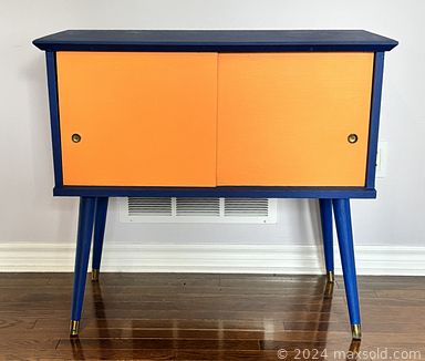 MaxSold Auction: This auction features Waterford Lamps, Art Prints, Record Cabinet, MCM Desk, Chairs, Chest, Bike  much more!