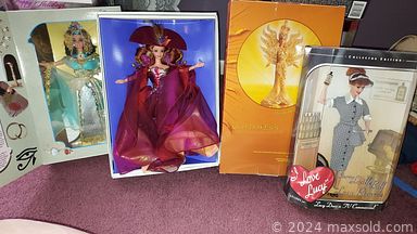 MaxSold Auction: This online auction features a chest of drawers, dresser with mirror, Captain\'s Bed, curio cabinet, hurricane lamp, flatware, coin sets, Betty Boop figures, collectible bear dolls, exercise bike and much more!