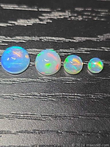 MaxSold Auction: This online auction features loose opals, including jelly, black, rolling flash, honeycomb, fire, Ethiopian, and more!