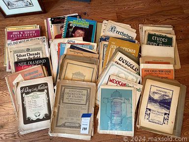 MaxSold Auction: This online auction features costume jewelry, art pottery, fashion watches, handbags, shawls, scarves, perfume bottles, art glass, bell collection, cat collectibles, coloring books, TV, LPs, framed prints, barware, stained glass pictures, small kitchen appliances and much more!