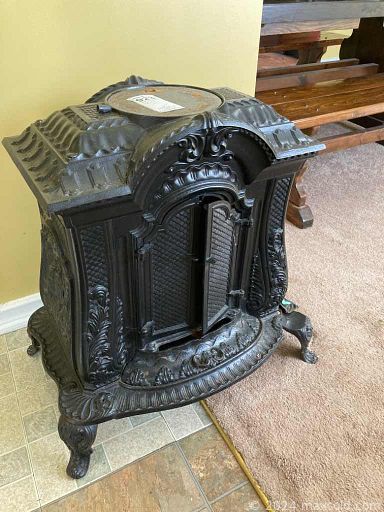 MaxSold Auction: This online auction features Rustic Dining Table With Benches, Cast Iron Woodburning Stove, China Closet, Hallmark Frosty Friends, Vintage Framed Art, Floor Lamps, Electric Metal Lead Fountain and much more!