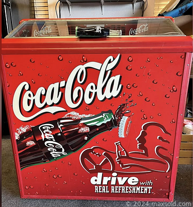 MaxSold Auction: This online auction features Coca-Cola glass top refrigerators, antique secretary desk, art glass, mirror/jewelry storage, runner, leather couch, small kitchen appliances, and more!