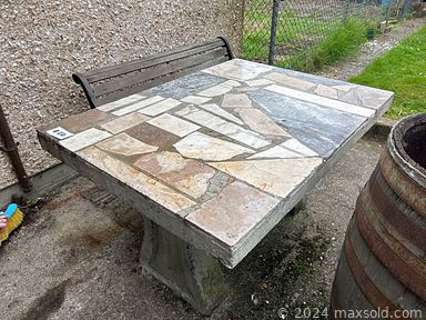 MaxSold Auction: This online auction features outdoor concrete table, bottles, furniture such as dresser, dining table, sofa and much more!