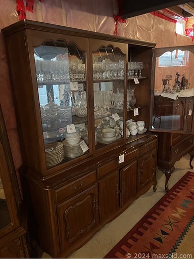 MaxSold Auction: This online auction features furniture such a patio set, dining table chairs, loveseat, couch, coffee table, sofa table, wooden dining table, double bed, chest, display cabinet, curio cabinet and others, seasonal decor, wine making supplies, Stokes silverware set, kitchenware, small kitchen appliances, area rugs, decor, collectibles, crystalware, Alba Julia dinnerware, Crown Ware china, linens, Davidson electric guitar, linens, office supplies, Moto Master air compressor, tools, stand up freezer and much more!