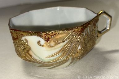 MaxSold Auction: This online auction features guitar, vintage books, Belleek china, stone carving, nesting dolls, video game console & games, art pottery, vintage trunks, ceramic figurines, kimonos, teacup/saucer sets, watch, sofa bed, and much more!