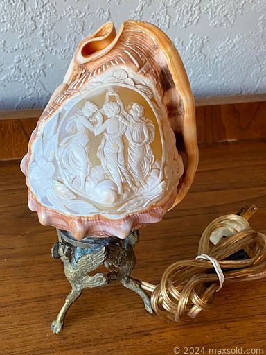 MaxSold Auction: This online auction includes an antique claw footed stein, Satsuma plate, Tibetan stamps, Sevres porcelain figurine, Indigenous raven hat, Swarovski clock, ornament, watches, antique till, silver lidded box, Japanese woodblock print and other wall art, coins, Chinese table folding screen, Mother of Pearl fish set, vases, baskets, cribbage board, .800 silver flute, nautical ship’s lantern, Northwest Coast wall plaques, lamps, pottery, jewelry such as 14k gold earrings, diamond ring, opal ring, bakelite necklace, pearl earrings and much more!