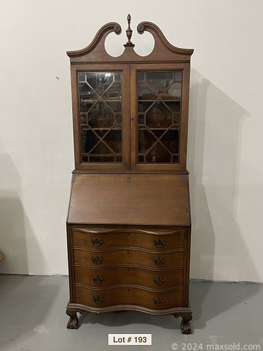 MaxSold Auction: This online auction features an African Art buffet, artwork, kitchen cabinet, Mahogany secretary cabinet, loveseat, glassware, chairs, tables, napkin holders turntable, brass lot,  Sewing Machine wheelbarrow  stainless flatware kitchen utensils, Trays candlesticks ottoman, MCM furniture, mirrors, pine wood shelves, chandelier, bathroom items, baker\'s lot and much more