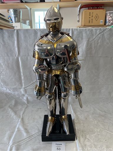 MaxSold Auction: This online auction includes a small knight suit of armor, engine order telegraphs, brass ships wheel, US Navy spyglass, holsters, Swiss Army tools, military bugles, bugle lamp, decor, lighters, watches, satchels and much more!