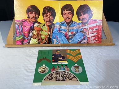 MaxSold Auction: This online auction features original watercolors, James Homes photographs, leather bags, costume jewelry,  vintage ceramic masks, antique daguerreotypes, antique Magic Lantern slides, art glass, vintage Asian porcelain, decorative plates, art pottery, cranberry glass, vintage cloisonne, S & P shakers, Fenton glass, Laserdisc collection, cameras, barristers bookcase, Burmese carved wood chair, and much, much, more!!!