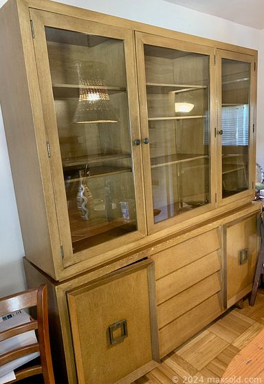 MaxSold Auction: This online auction features MCM chairs, mid-century breakfront, mid-century couch, books, home decor, glassware, signed wall art, Meito china and much more!