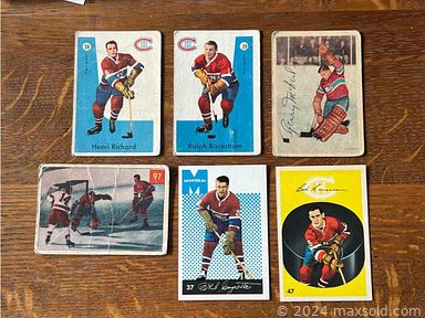 MaxSold Auction: This online auction features sports collectibles, cookie jar, postcards, train cars, banknotes, German vase, African basket & bowl, roll top desk, Victorian vanity, antique books, grandfather clock, stained glass butterfly lamp and much more!