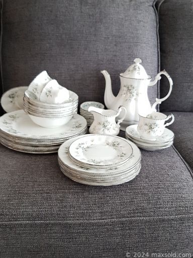 MaxSold Auction: This online auction features storage units, picture collections, pine bookcase, teak end table, antique mirrors, chairs, twin window fan, Paragon china, hutch, dresser, Singer sewing machine, Sparton record player, stereo cabinet and much more!