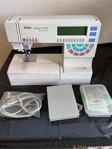 MaxSold Auction: This online auction features sewing machines, craft supplies, generator, air compressor, stained glass chandelier, small kitchen appliances, cookie jar, oil lamps, antique dresser, antique spinning wheel, collector plates, vintage books, antique wool winder, teacup/saucer sets, doll making supplies, Royal Doulton figurines, crocks, antique settee, fabric, collector spoons, games, and much, much, more!!!