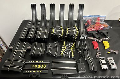 MaxSold Auction: This online auction includes storage boxes, crystalware, coins, banknotes, VHS, DVDs, 35mm cameras, watches, jewelry, vintage perfume bottles, Hockey and other trading cards, trumpets, electronics, diecast cars, train set and other toys, Nintendo DS, Wii U console, pottery, Willow Tree figure, replica payphone and much more!