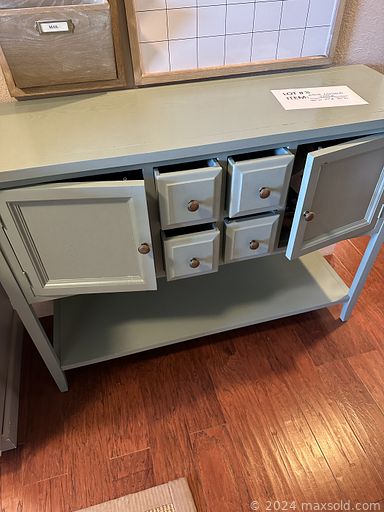 MaxSold Auction: This online auction features glass top tables, oak barrel table, sideboard, treadmill, shelving units, armoire, sports trading cards, storage bench, guitar, decanters, and more!