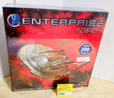 MaxSold Auction: This online auction features Star Trek collectibles, antique student desk, vintage mirrors, model train kits, train cars, vintage ladies\' clothing, vintage neckties, porcelain dolls, teacup/saucer sets, vintage magazines, and much more!!