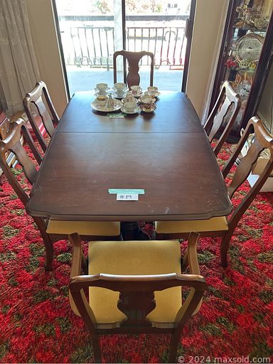 MaxSold Auction: This online auction features outdoor concrete table, bottles, furniture such as dresser, dining table, sofa and much more!