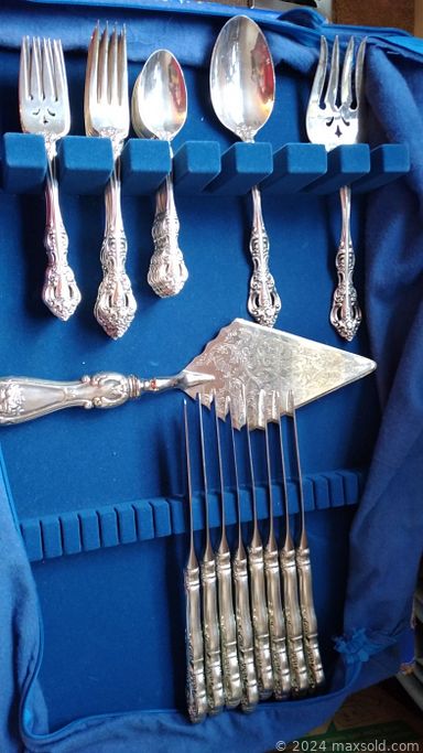 MaxSold Auction: This online auction features a chest of drawers, dresser with mirror, Captain\'s Bed, curio cabinet, hurricane lamp, flatware, coin sets, Betty Boop figures, collectible bear dolls, exercise bike and much more!