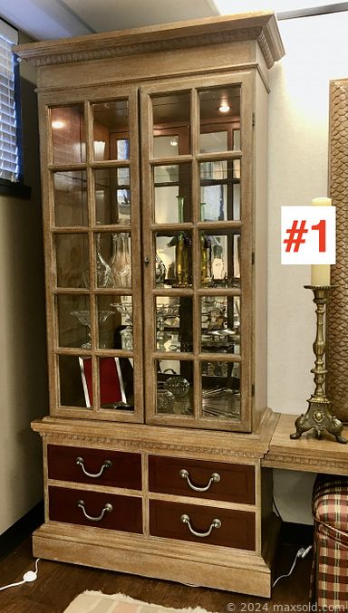 MaxSold Auction: This online auction includes furniture such as tall display cabinets, wrought iron console table, Giorgetti sofa, Ekornes leather chair, nightstands, bedframe and others, Burmese rain drum, lamps, Kosta Boda, MCM figurines, mirror, rugs, books, clothing, watercolor supplies, tea service, pottery vase, rugs, wall art and more!