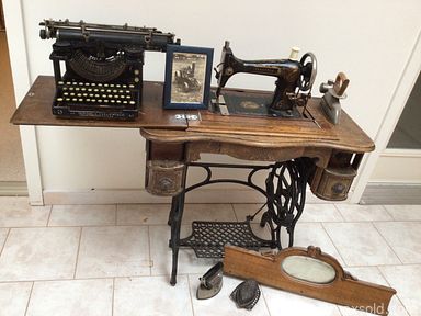 MaxSold Auction: This online auction features a curio cabinet, sideboard, wood cabinet, wagon wheel table, side tables, secretary, sideboard, Knetchel cabinet, sewing machine in cabinet, typewriter, cathedral mirror, vintage radio, model sailboat, lamp posts and much more!