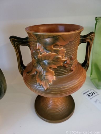 MaxSold Auction: This online auction features Roseville vase, steins, Toby jug, vintage dolls, pewter plates, vintage books, a wooden desk, area rugs, antique brass bed, toys, milk glass, board games, puzzles, 4-poster bed, and much more!