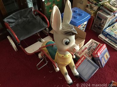 MaxSold Auction: This online auction features depression glass, dresser sets, collector’s plates, Hummels, milk glass, cookie jars, art glass, Stangl pottery, steins, church chandelier, teapots, cedar chest, McCoy pottery, wicker furniture, toys, board games, vintage cameras, vintage tins, costume jewelry, table lamps, decanters, vinyl records, hand tools, skeet targets, play kitchen, stained glass windows and much more!