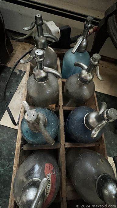 MaxSold Auction: This online auction features various items such as wood valet, vintage chair, Velour hassock, nightstand, Lawn fertilizer, Era Collection, Sled Decor, lamps, Christmas decor, china bowl, vintage chair, books, seltzer bottles, vase, file cabinet, chandelier, antique couch, antique table and much more!