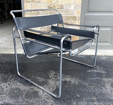 MaxSold Auction: This online auction features vintage Wassily chair, art glass, Inuit stone carvings, Tiffany style table lamp, art pottery, Satsuma vase, vintage Pyrex, antique Flow Blue dishes, teacup/saucer sets, porcelain doll, vinyl records, room divider, vintage tins, vintage barware, vintage Moorcroft, costume jewelry, stereo components, sports trading cards, and much, much, more!!!