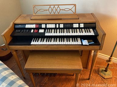 MaxSold Auction: This online auction features vintage stained glass lamps, framed artwork, furniture such as MCM teak desk, vintage rocking chair, sofa beds and vintage wood dresser, acoustic guitar, Wurlitzer organ, holiday decor, small kitchen appliances and much more!