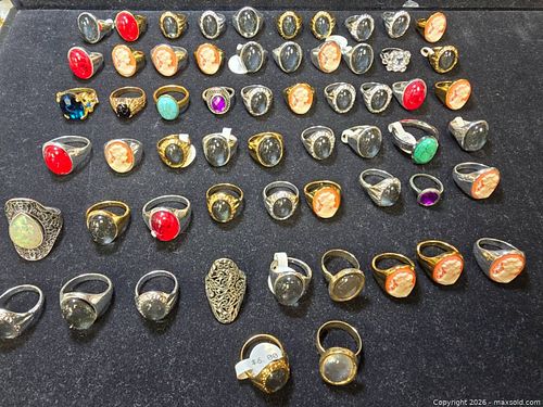collection of assorted gemstone rings, some featuring cameo designs. (1 of 9)
