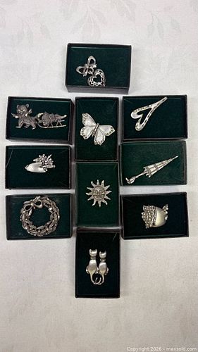collection of ten distinct vintage pewter brooches and pins,  (1 of 11)