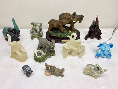 collection of various elephant figurines in different materials and styles,  (1 of 10)