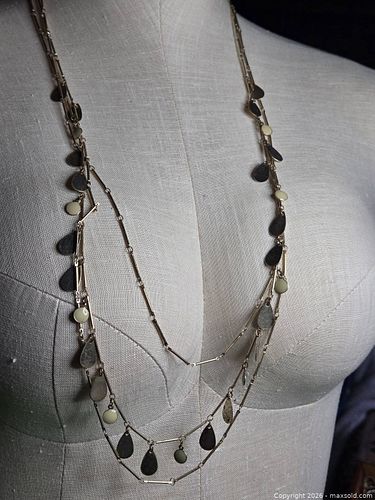 Jewelry.  Gold tone multi chain necklace with variety of accents in gold/ ivory/brass colors.  (1 of 3)