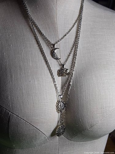 Jewelry.  Silver tone 4 layer chain with assorted religious /spiritual/ cultural pendants.   (1 of 4)