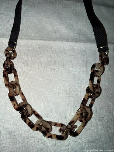 LONG BROWN PLASTIC CHEETAH CHARMS ON BROWN RIBBON NECKLACE  (1 of 3)
