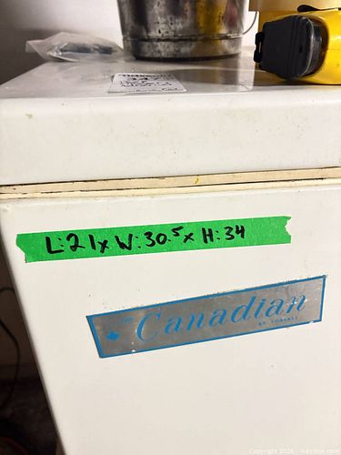 Small White Upright Freezer with Chrome Accents and items on top (1 of 4)