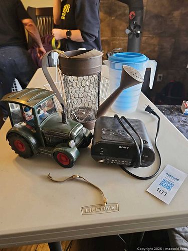Lot: Sony Clock Radio, Tractor Figurine, Watering-Can Vase, Pitcher, Bracelet (1 of 7)