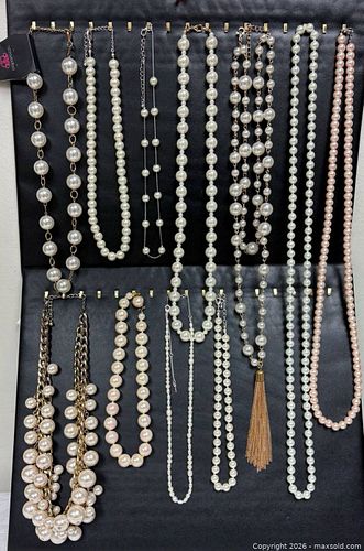 collection of costume jewelry necklaces, primarily featuring faux pearls.  (1 of 9)