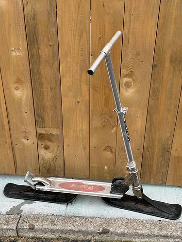 Razor kick scooter with added plastic skis for riding on snow (1 of 3)