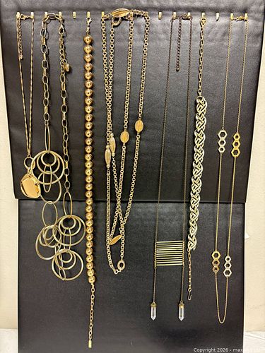 collection of gold-toned jewelry likely features statement pieces from various brands,  (1 of 14)